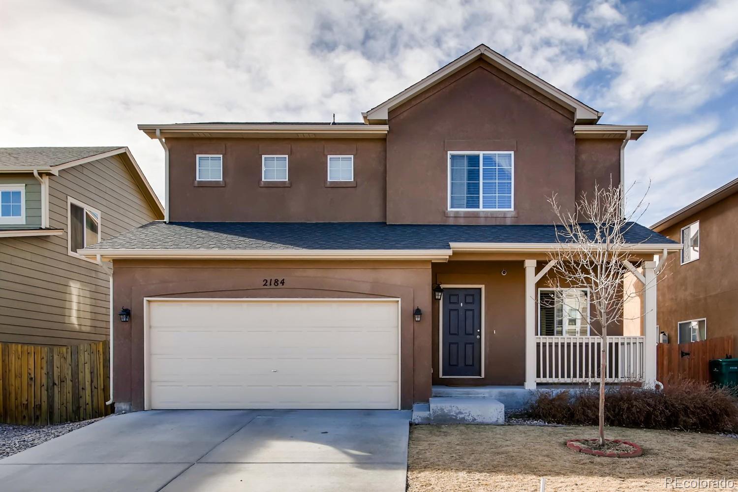 2184 Reed Grass Way Colorado Springs, CO 80915 - Photo 1 of 29 a front view of a house