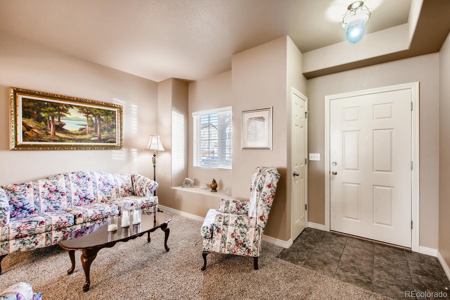 2184 Reed Grass Way Colorado Springs, CO 80915 - Photo 12 of 29 a bedroom with furniture and a bed