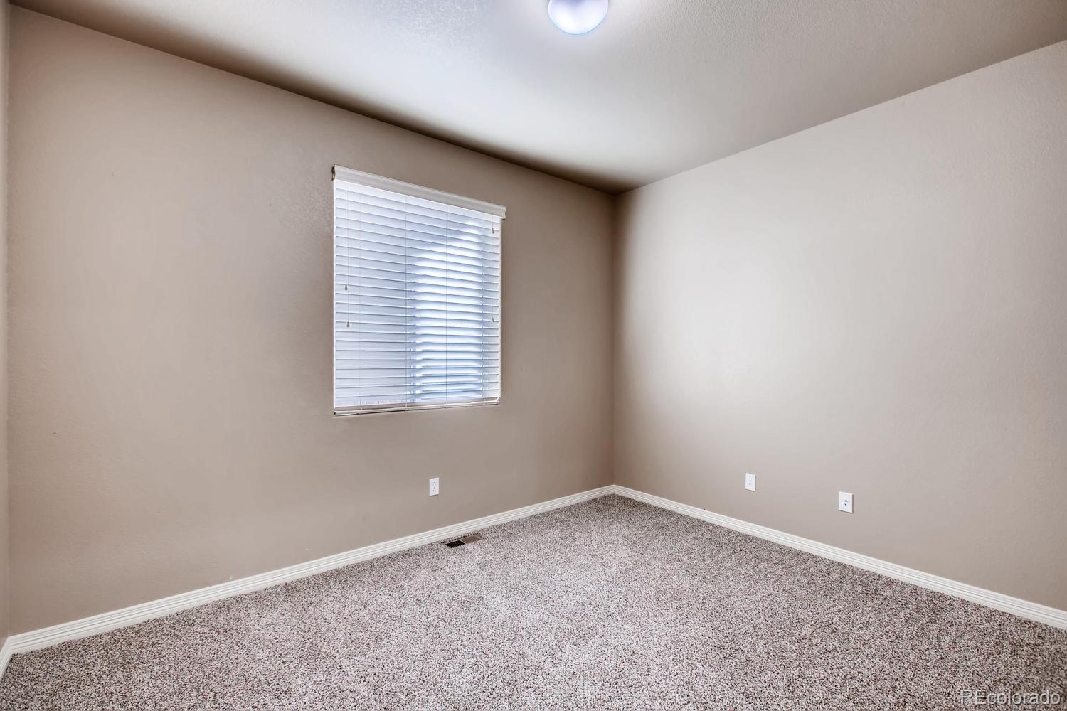 2184 Reed Grass Way Colorado Springs, CO 80915 - Photo 14 of 29 an empty room with a window