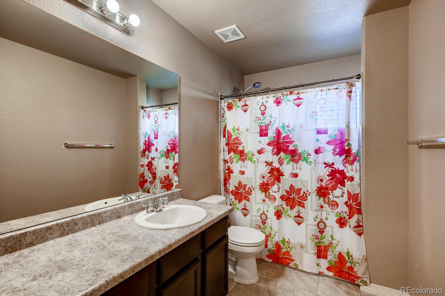 2184 Reed Grass Way Colorado Springs, CO 80915 - Photo 26 of 29 a bathroom with a sink and a mirror