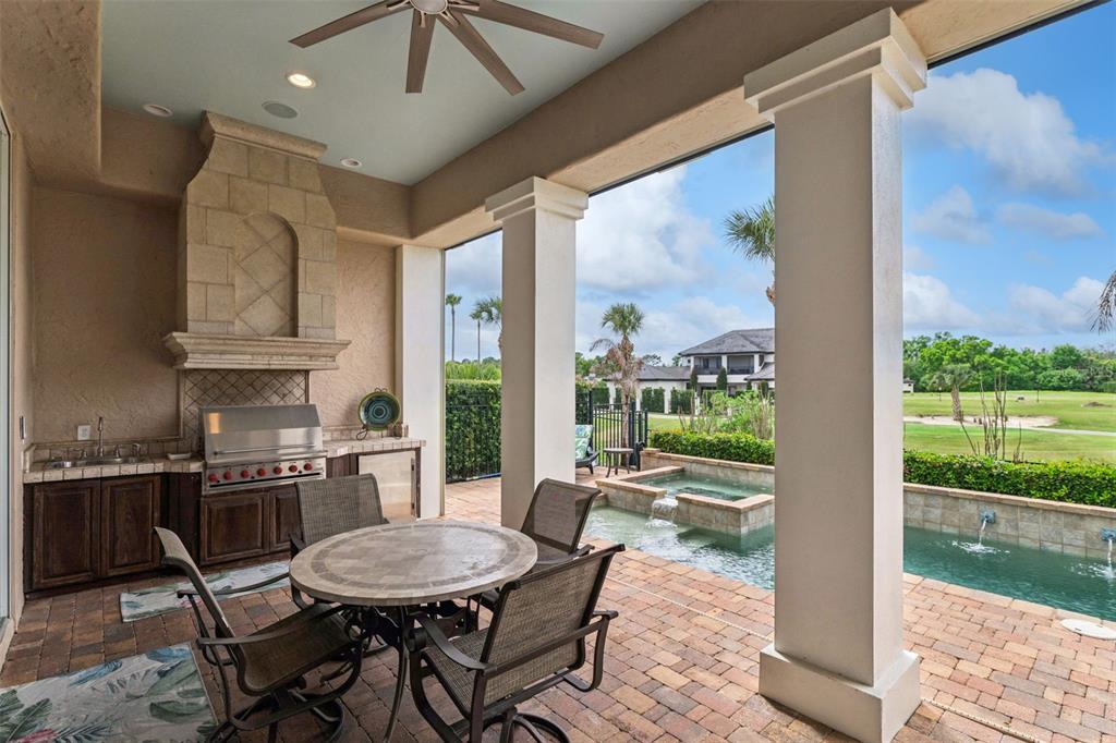 1172 Castle Pines Court Reunion, FL 34747 - Photo 12 of 65 a dining room with furniture a rug and a floor to ceiling window