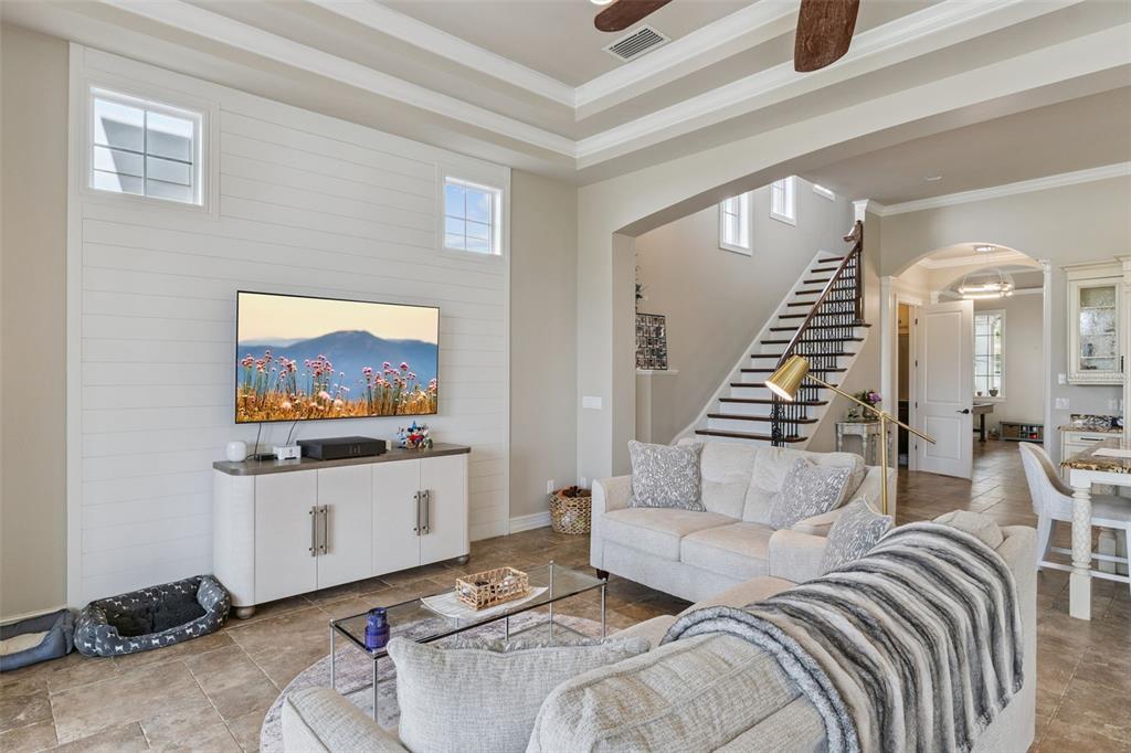 1172 Castle Pines Court Reunion, FL 34747 - Photo 19 of 65 a living room with furniture and a flat screen tv