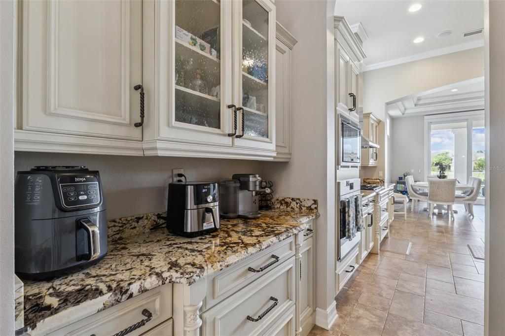 1172 Castle Pines Court Reunion, FL 34747 - Photo 20 of 65 a kitchen with stainless steel appliances granite countertop a stove and a sink