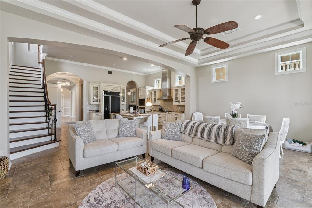 1172 Castle Pines Court Reunion, FL 34747 - Photo 24 of 65 a living room with furniture a ceiling fan and a rug