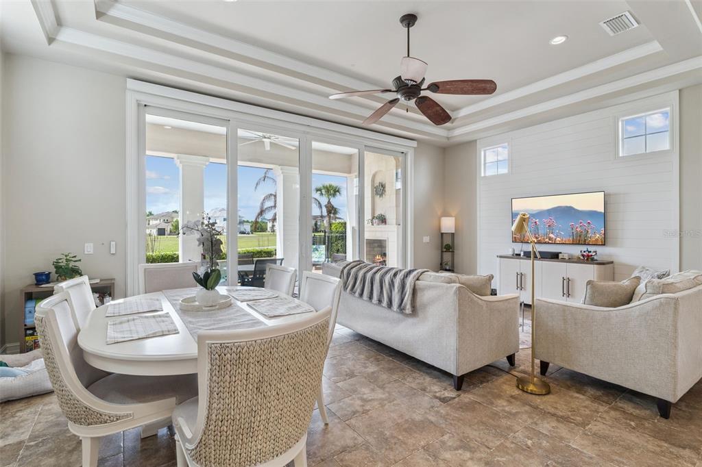 1172 Castle Pines Court Reunion, FL 34747 - Photo 25 of 65 a living room with furniture and a flat screen tv