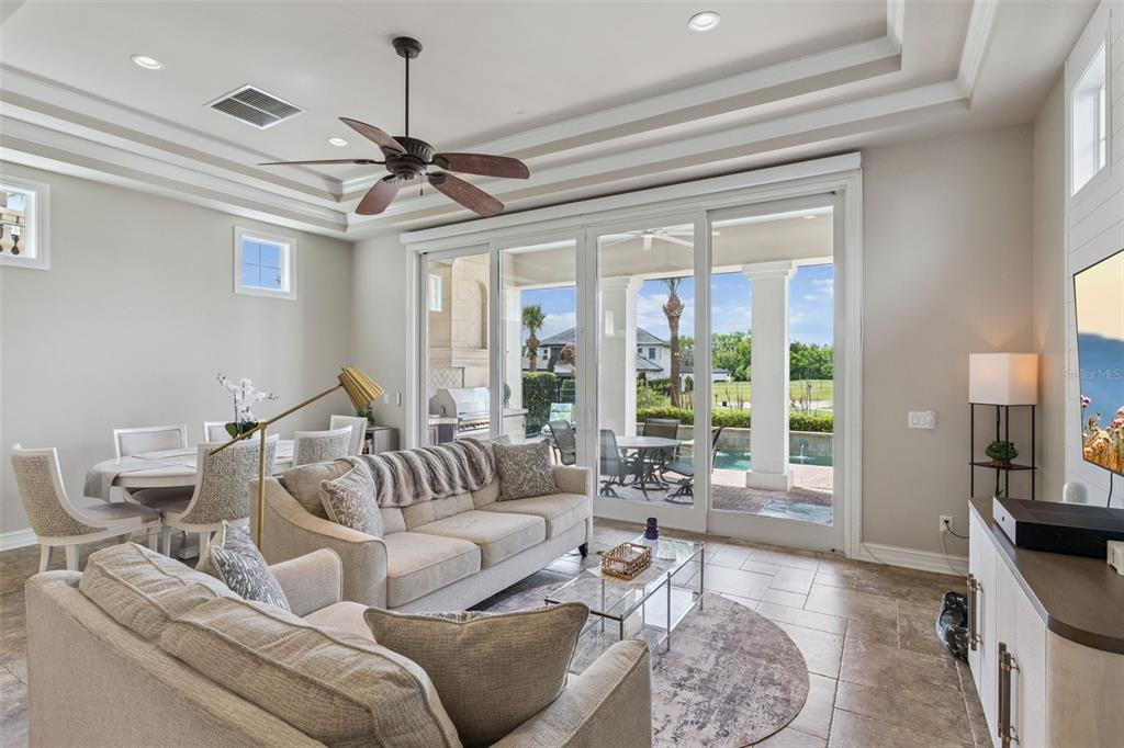 1172 Castle Pines Court Reunion, FL 34747 - Photo 4 of 65 a living room with furniture and a large window