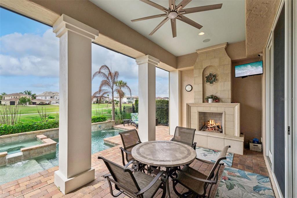 1172 Castle Pines Court Reunion, FL 34747 - Photo 41 of 65 a dining room with furniture a floor to ceiling window and outdoor view