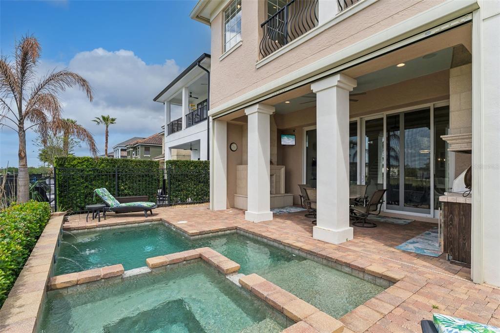 1172 Castle Pines Court Reunion, FL 34747 - Photo 43 of 65 a view of a house with swimming pool and sitting area