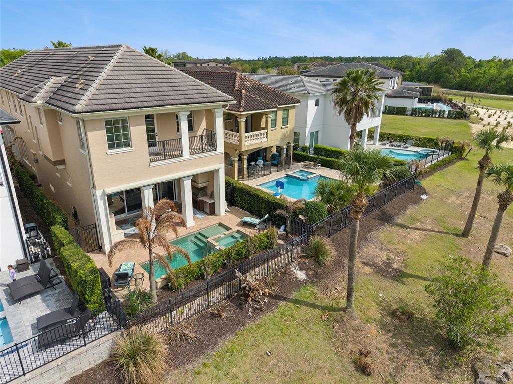 1172 Castle Pines Court Reunion, FL 34747 - Photo 47 of 65 a aerial view of a house with a yard