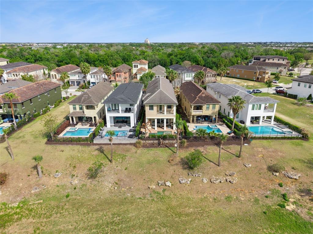 1172 Castle Pines Court Reunion, FL 34747 - Photo 50 of 65 an aerial view of residential houses with outdoor space and street view