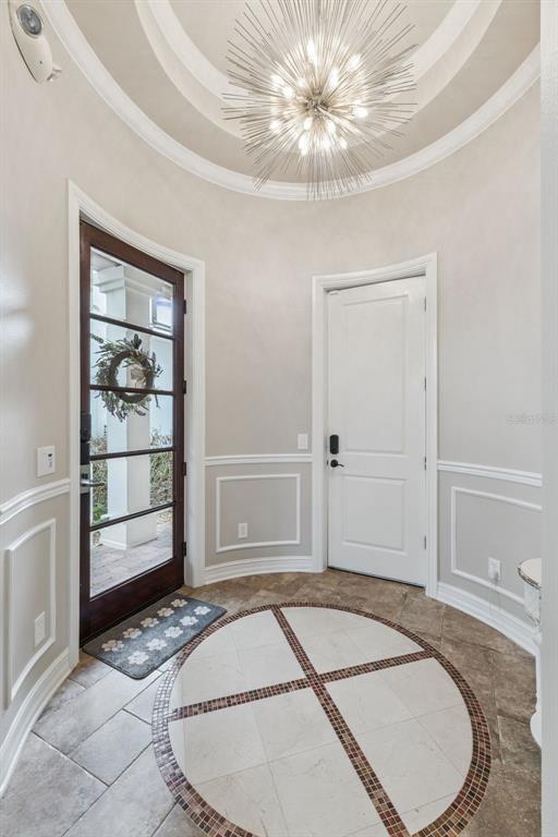 1172 Castle Pines Court Reunion, FL 34747 - Photo 5 of 65 a bedroom with a bed and a window