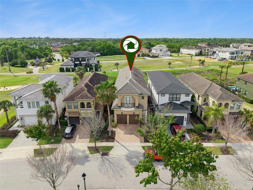 1172 Castle Pines Court Reunion, FL 34747 - Photo 52 of 65 an aerial view of a house with garden space and ocean view