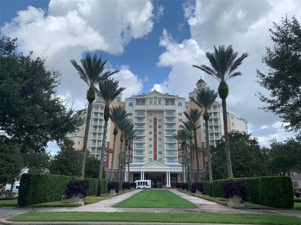 1172 Castle Pines Court Reunion, FL 34747 - Photo 54 of 65 a view of a building with a yard
