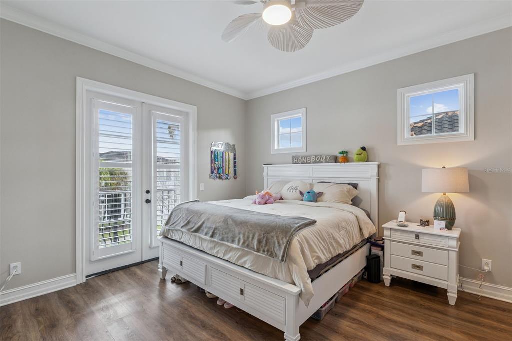 1172 Castle Pines Court Reunion, FL 34747 - Photo 10 of 65 a bedroom with a bed and a window