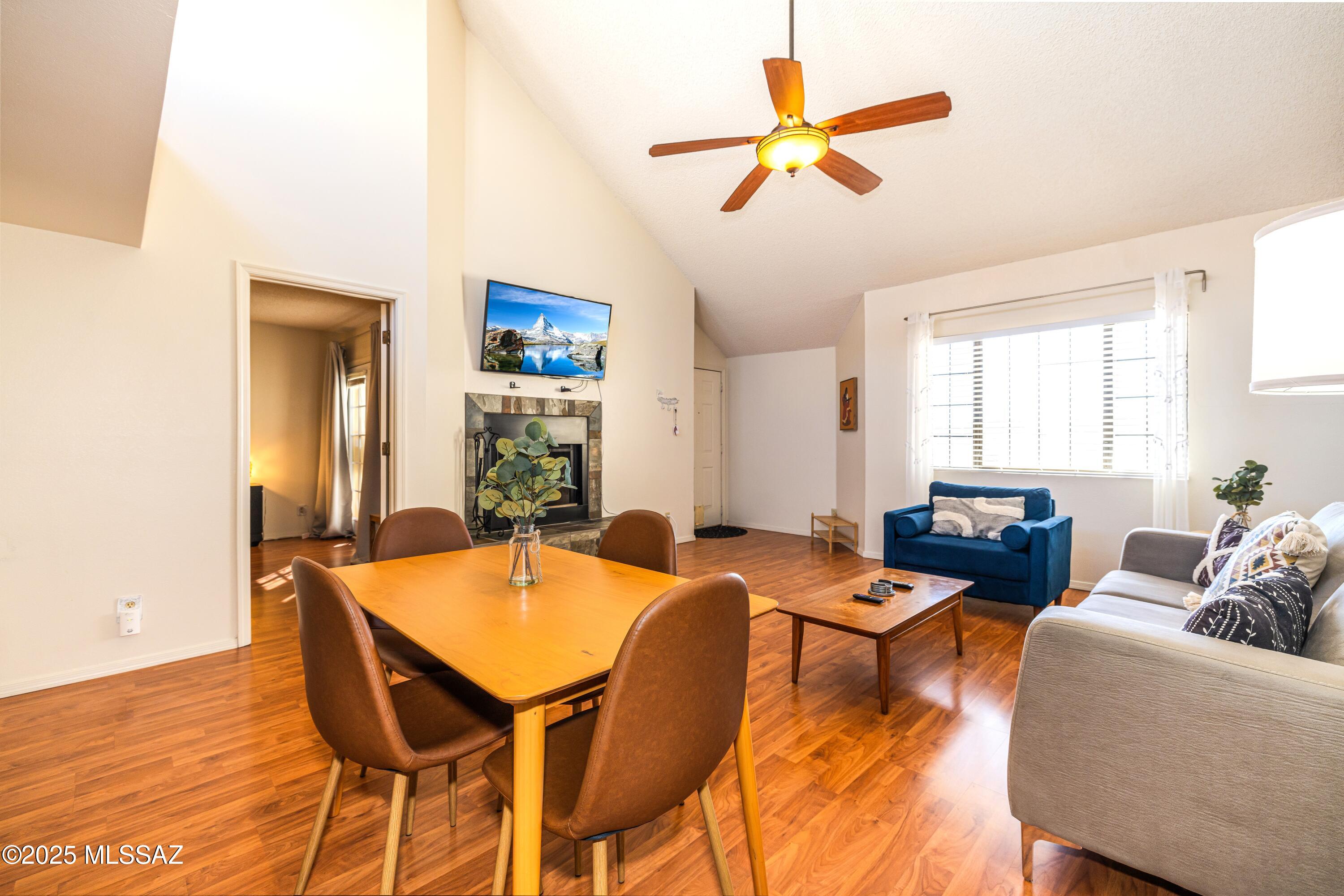 a dining room with furniture and window