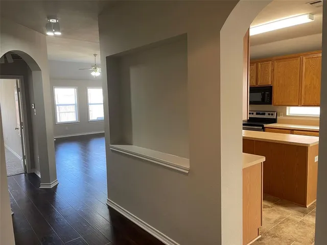 a kitchen with appliances and cabinets