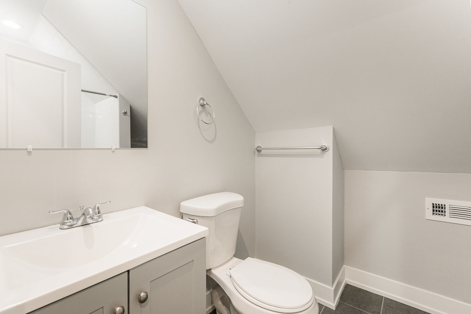 926 West 32nd Place, Unit 2F Chicago, IL 60608 - Photo 16 of 18 a bathroom with a sink a toilet and mirror