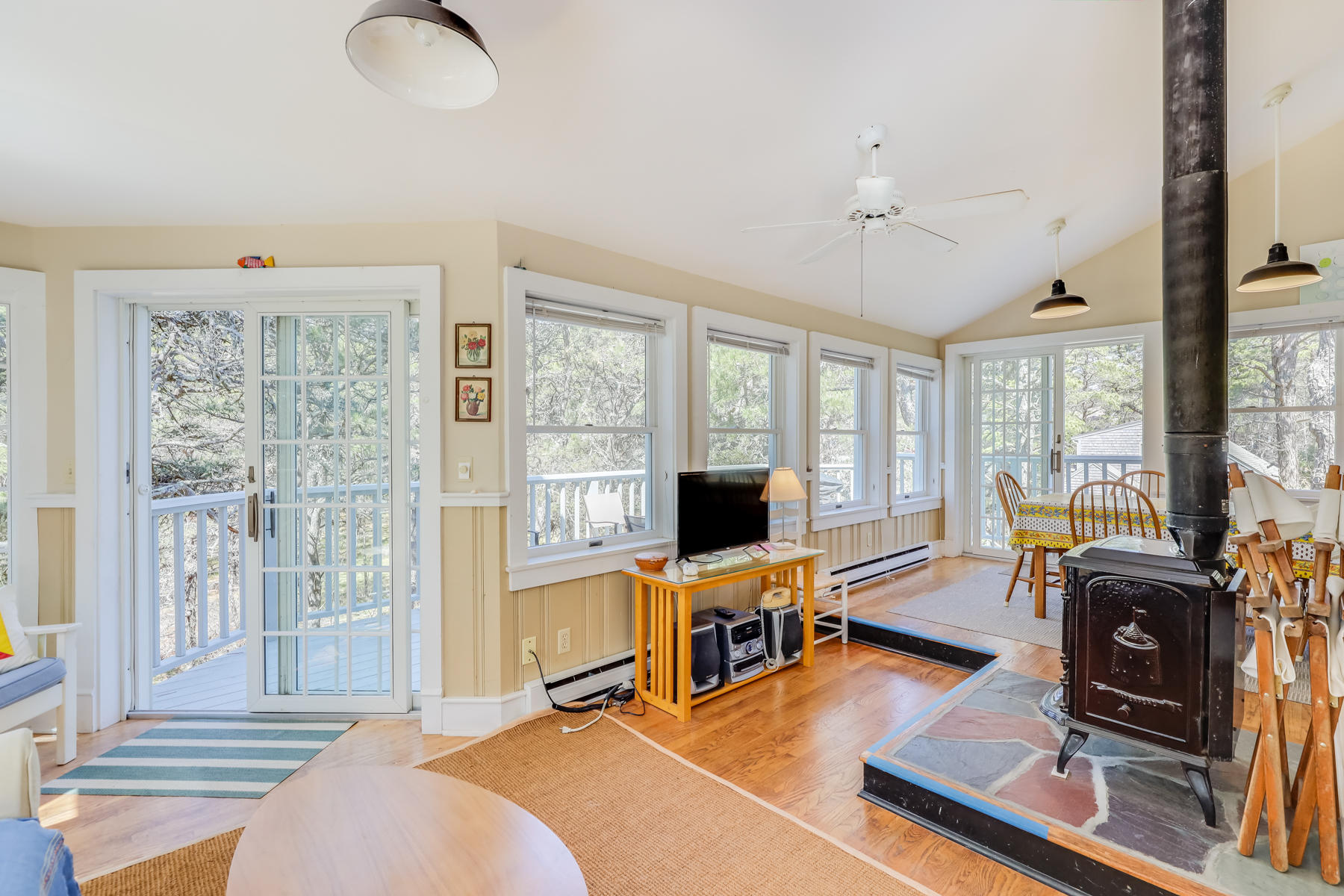 70 King Phillip Road Wellfleet, MA 02667 - Photo 4 of 29 a bedroom with furniture and a flat screen tv