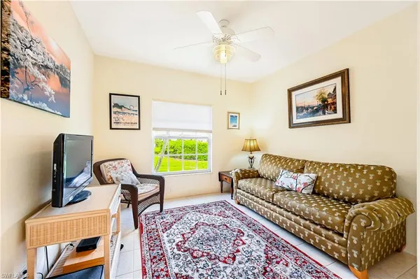 a living room with furniture and a window