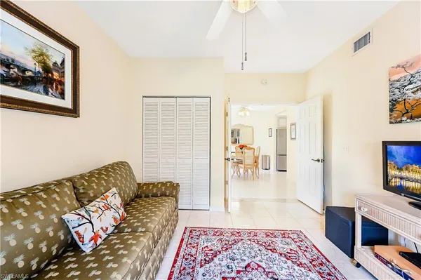a living room with furniture and a rug