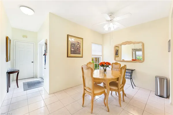 a dining room with furniture and window