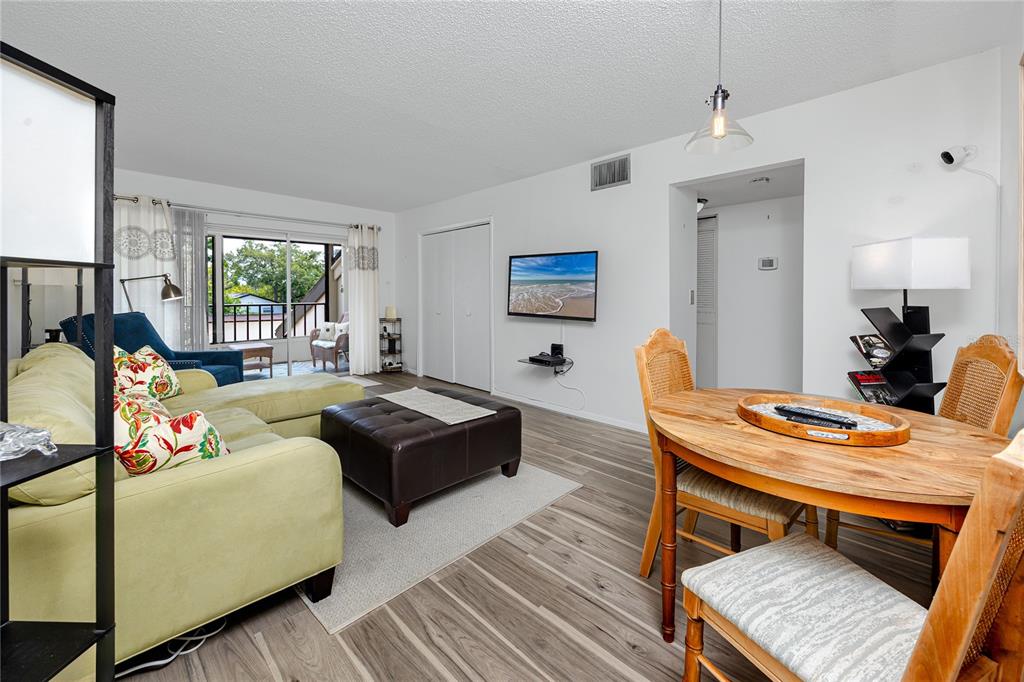 2207 Belleair Road, Unit B30 Clearwater, FL 33764 - Photo 11 of 39 a living room with furniture and a table