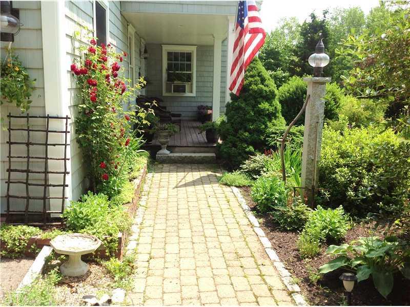 87 Town Farm Road North Yarmouth, ME 04097 - Photo 7 of 24 Exterior Front. Colorful gardens,...