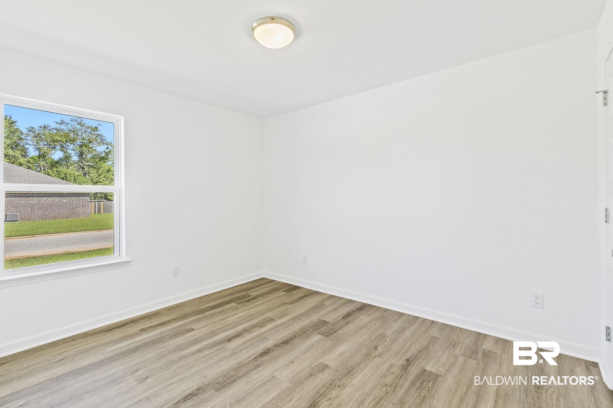 16014 Alabama Avenue Silverhill, AL 36576 - Photo 28 of 50 Spare room with light hardwood / wood-style floors
