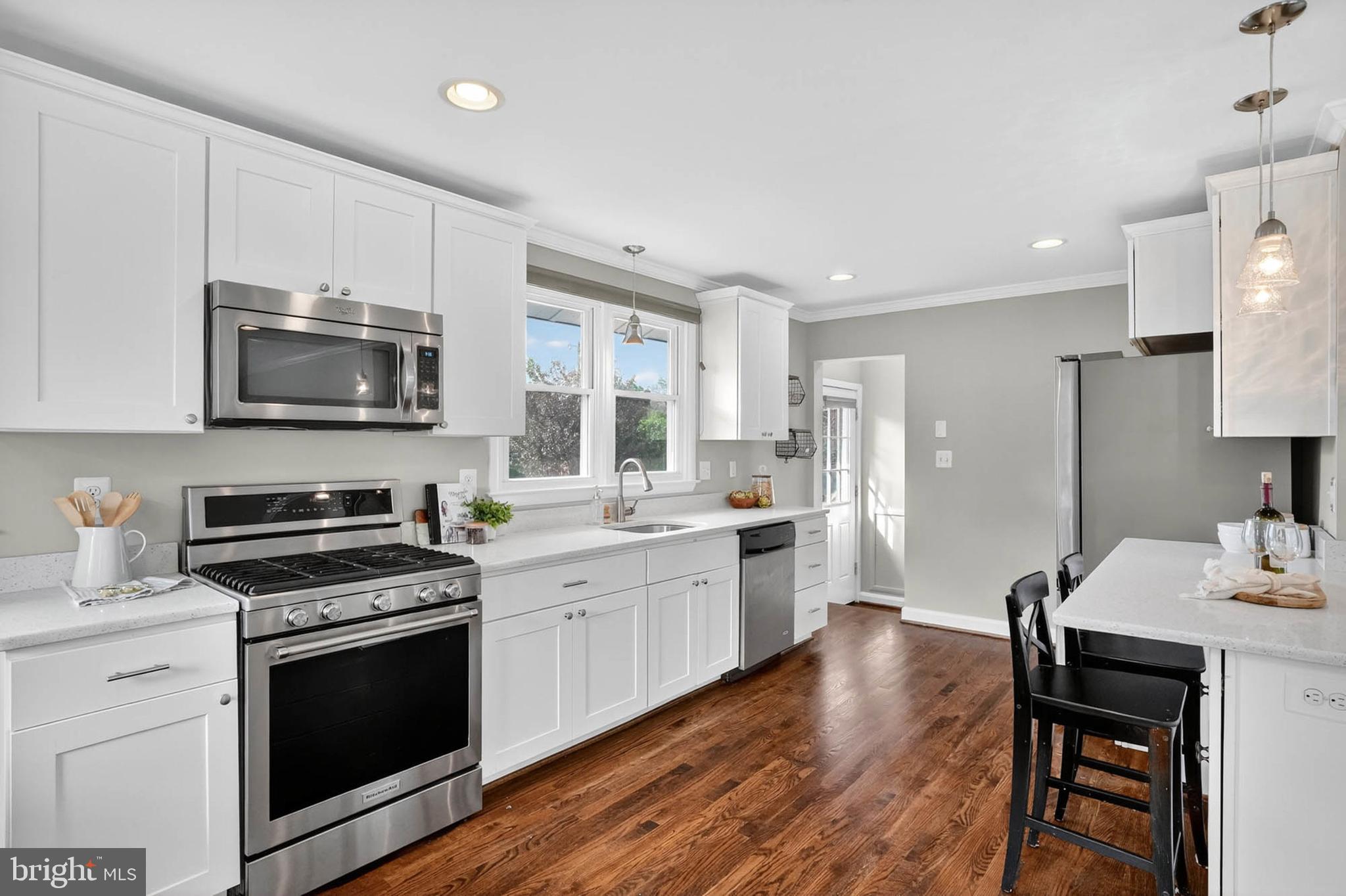 1920 Drummond Road Catonsville, MD 21228 - Photo 11 of 45 a kitchen with a stove a sink and a microwave