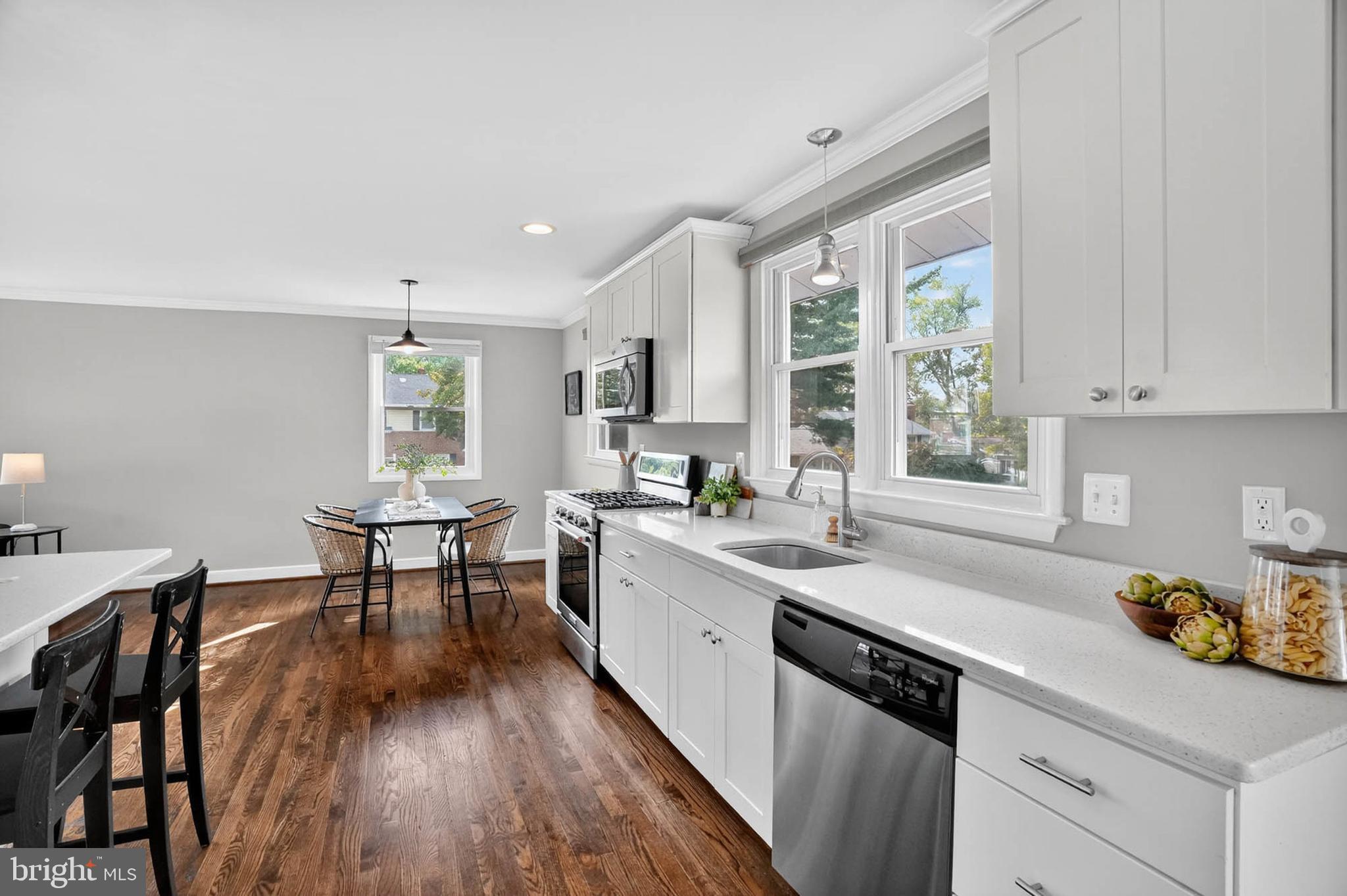 1920 Drummond Road Catonsville, MD 21228 - Photo 14 of 45 a kitchen with a sink window and cabinets