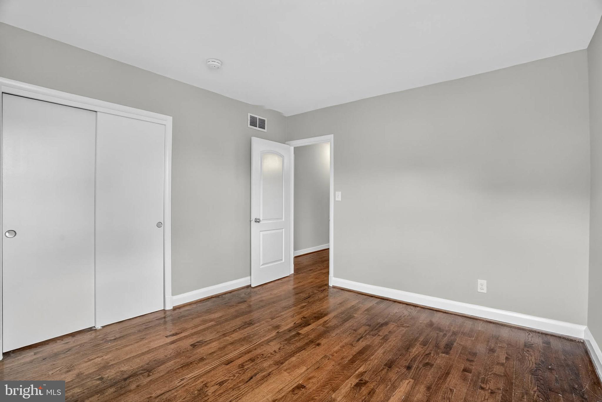 1920 Drummond Road Catonsville, MD 21228 - Photo 19 of 45 a view of an empty room with wooden floor