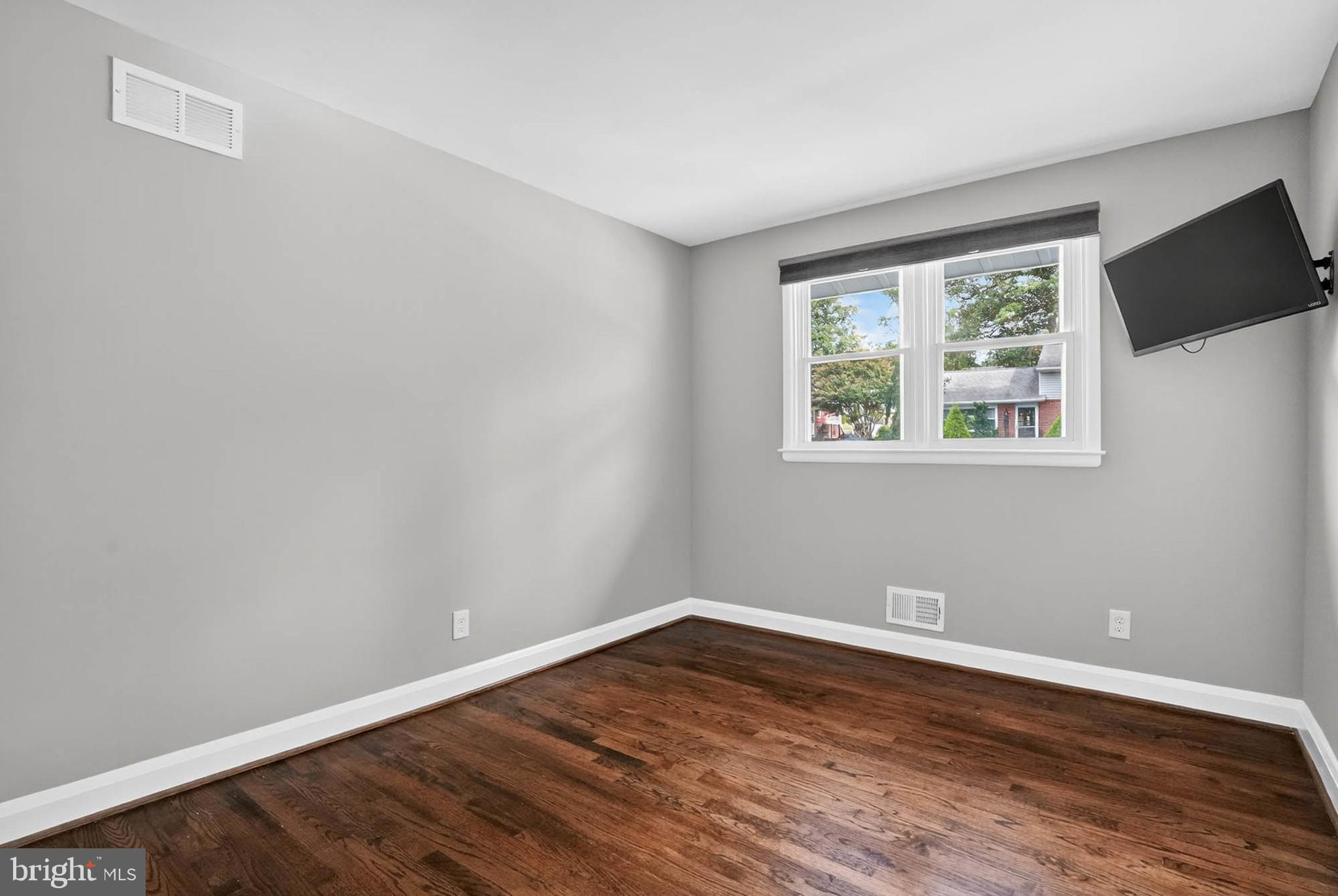 1920 Drummond Road Catonsville, MD 21228 - Photo 20 of 45 a view of a room with wooden floor and windows