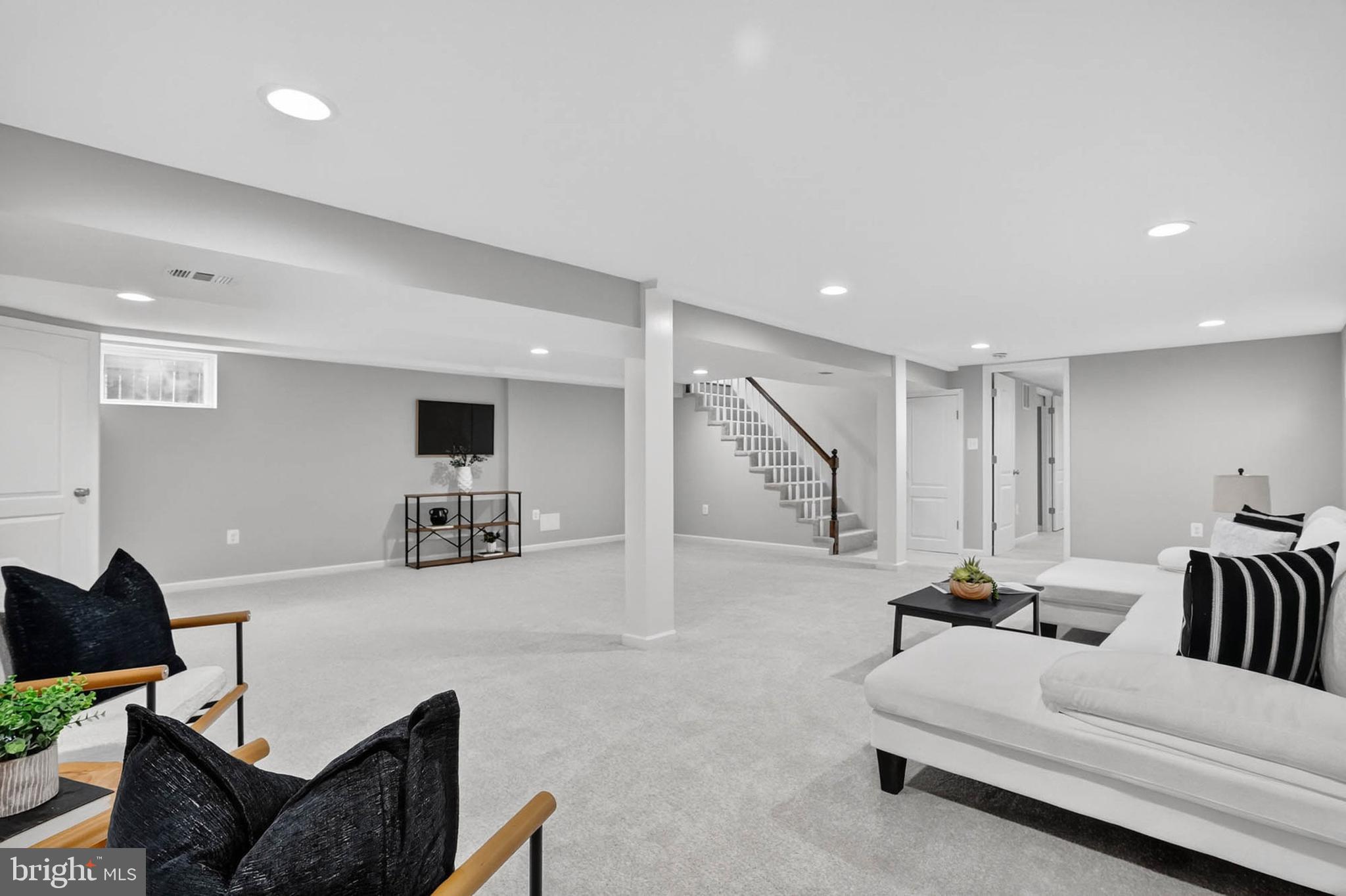1920 Drummond Road Catonsville, MD 21228 - Photo 25 of 45 a living room with furniture and a flat screen tv
