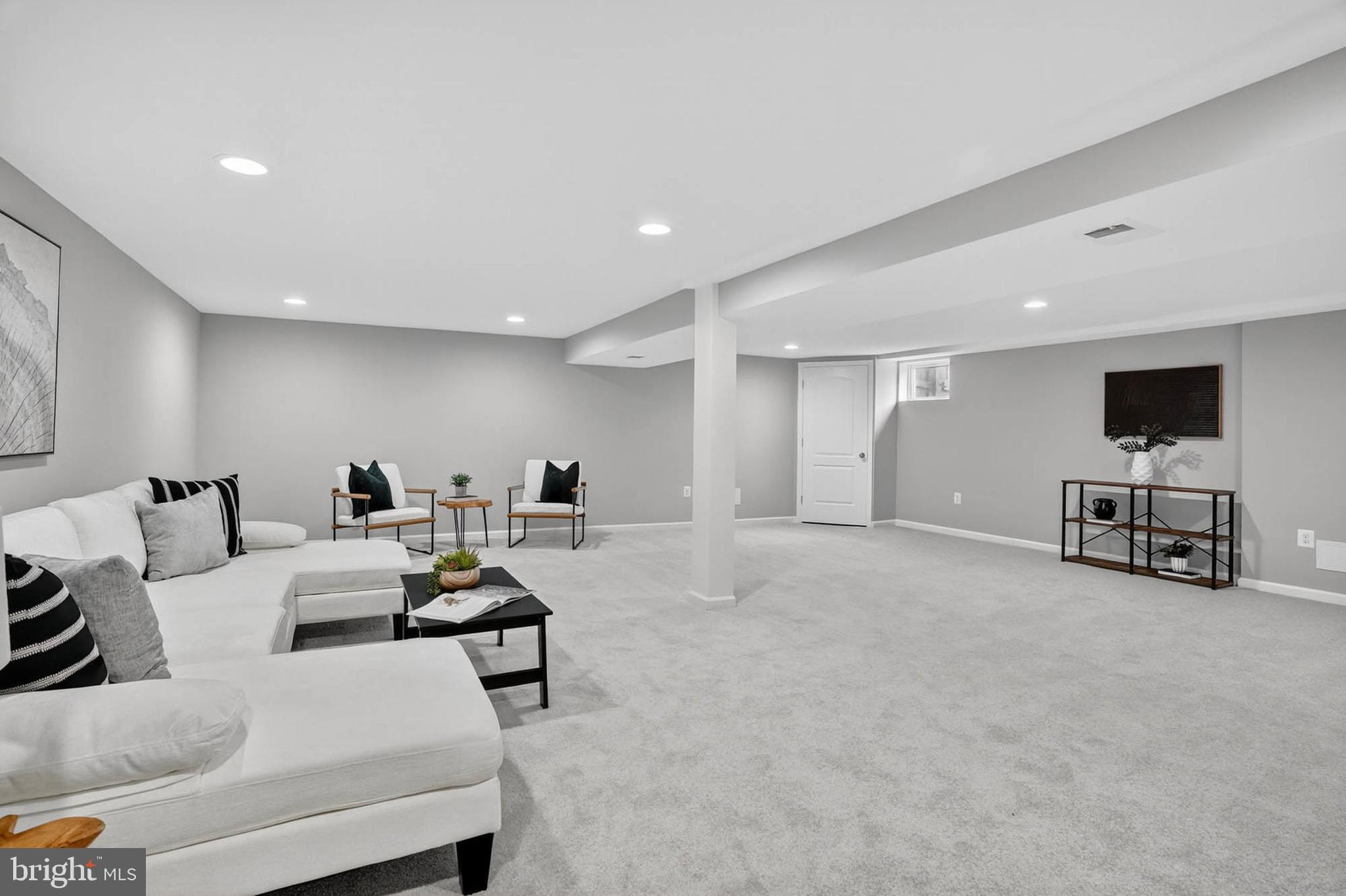 1920 Drummond Road Catonsville, MD 21228 - Photo 26 of 45 a living room with furniture and a flat screen tv