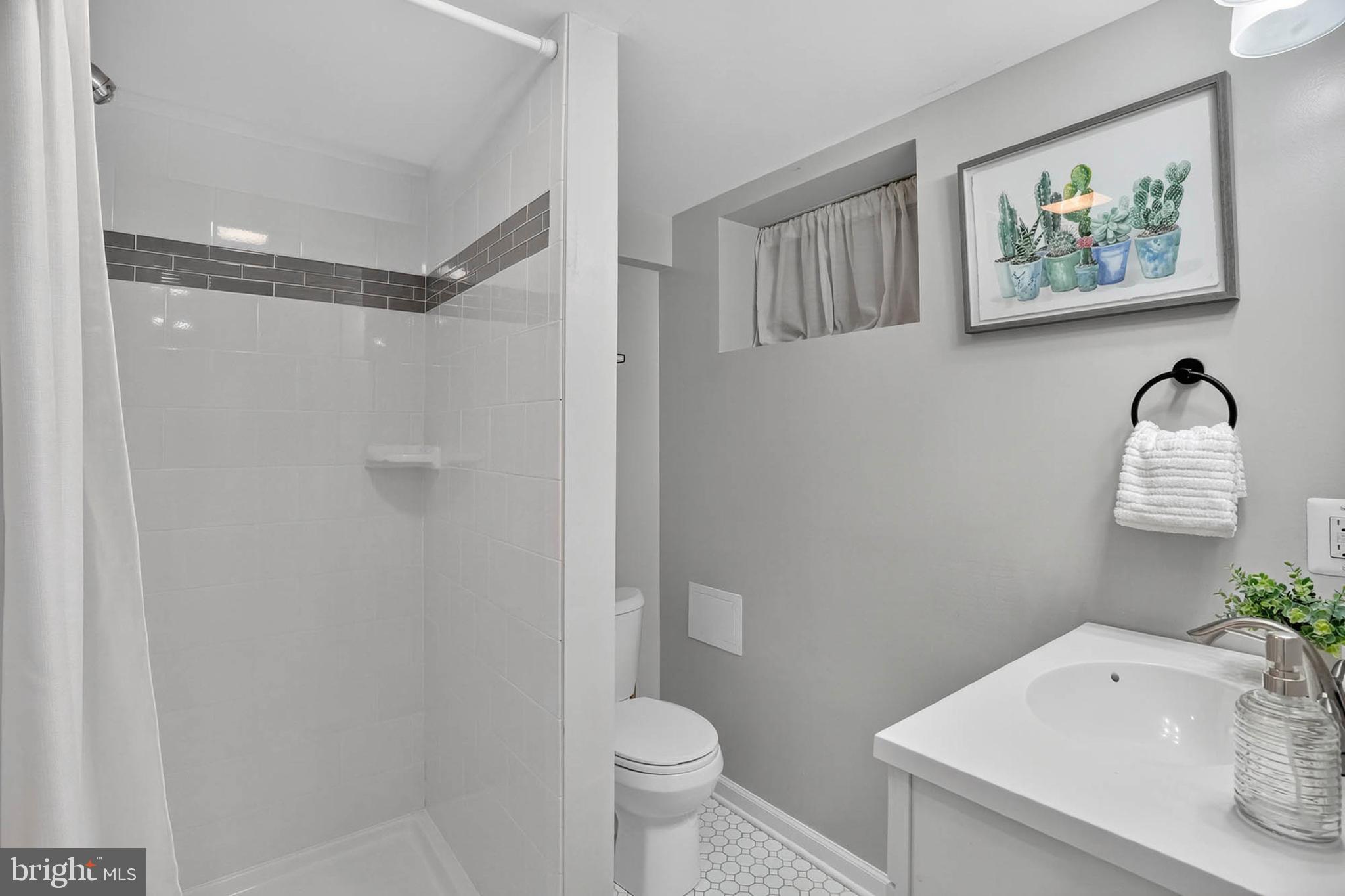 1920 Drummond Road Catonsville, MD 21228 - Photo 32 of 45 a bathroom with a sink toilet and vanity