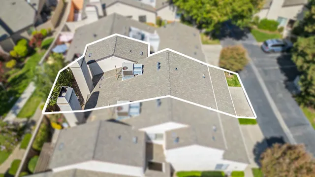 an aerial view of a house with swimming pool