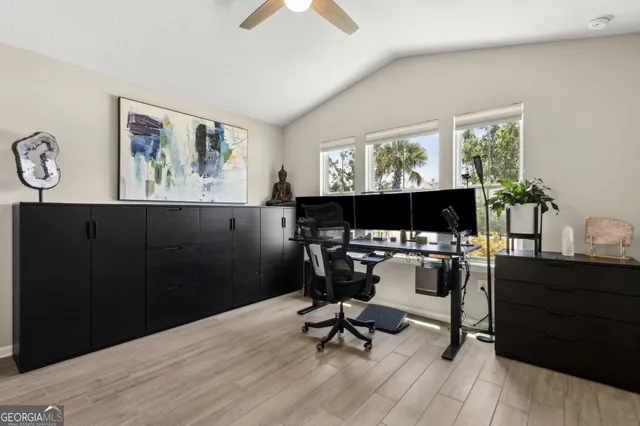 a view of a livingroom with furniture and a window