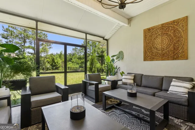a front view of a house with a garden and plants