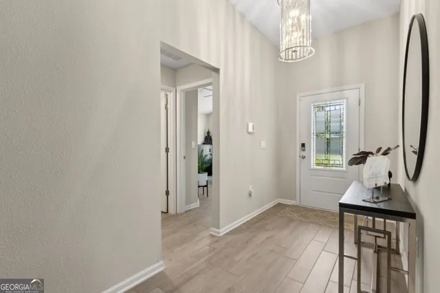 a living room with furniture floor and a flat screen tv