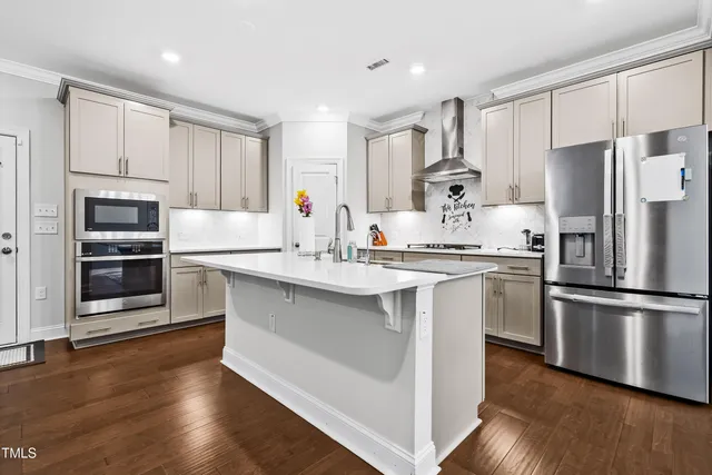 a kitchen with a sink stove and refrigerator