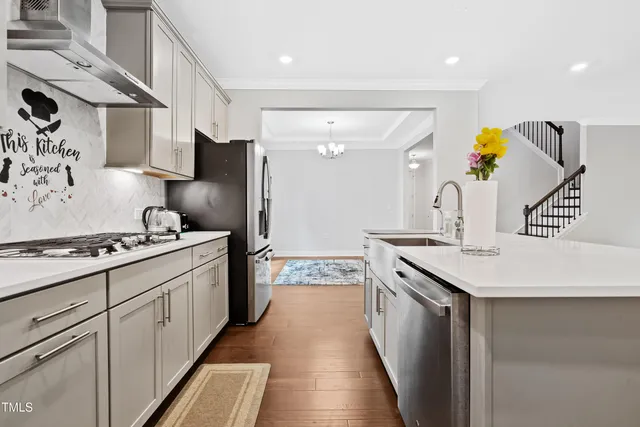 an empty room with wooden floor and fireplace
