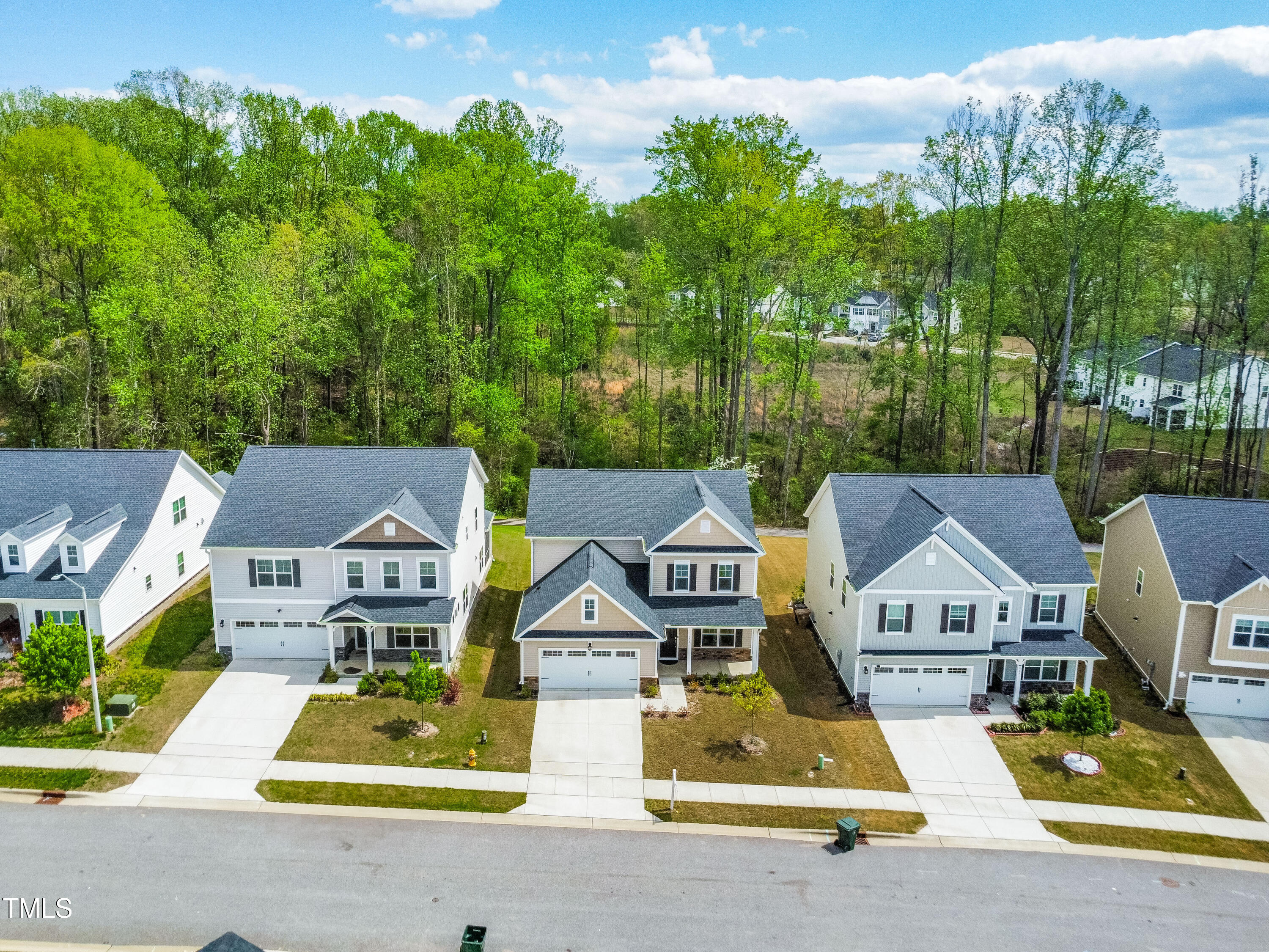 270 Trailing Blf Way Garner, NC 27529 - Photo 2 of 41 a aerial view of a house with swimming pool and garden