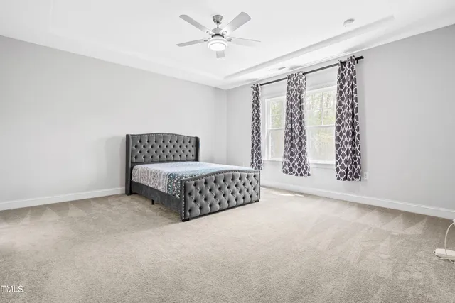 a bedroom with a bed and dresser