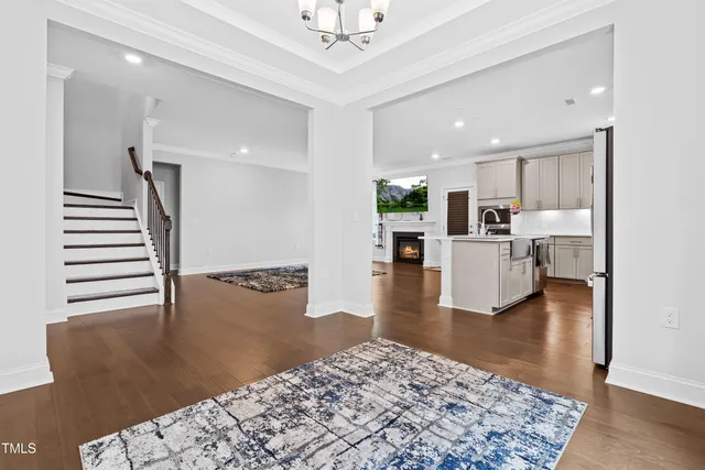 a kitchen with stainless steel appliances a refrigerator sink and cabinets