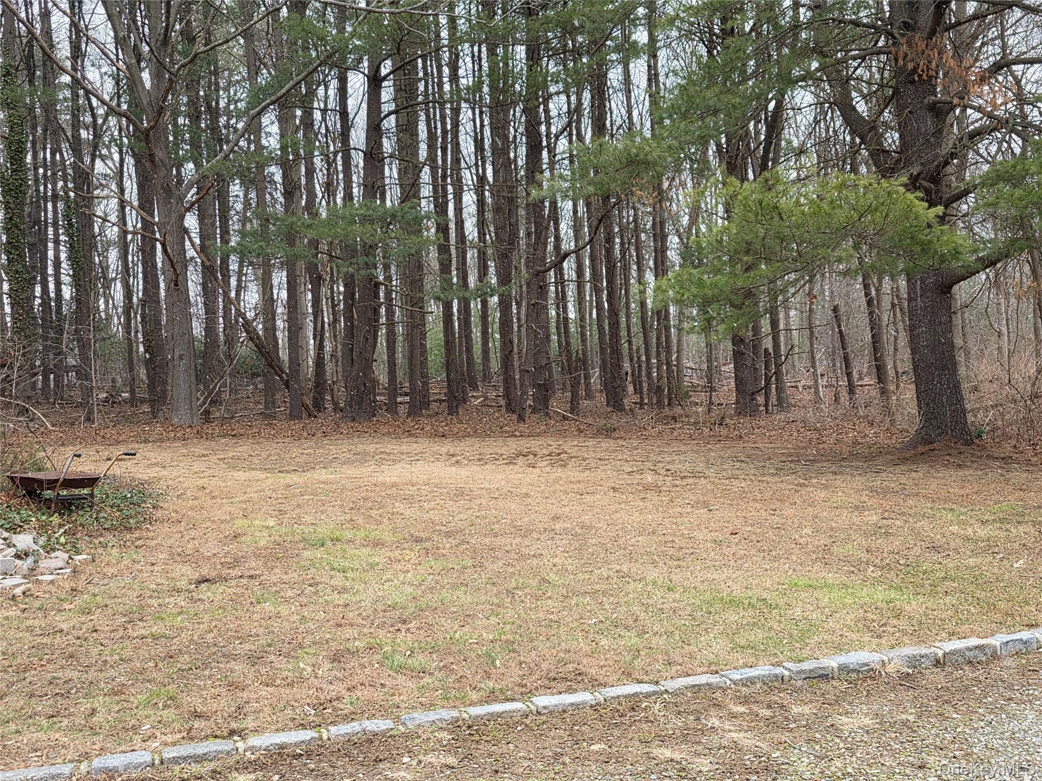 200 Deforest Road Dix Hills, NY 11746 - Photo 20 of 20 a view of wooden fence in front of a house
