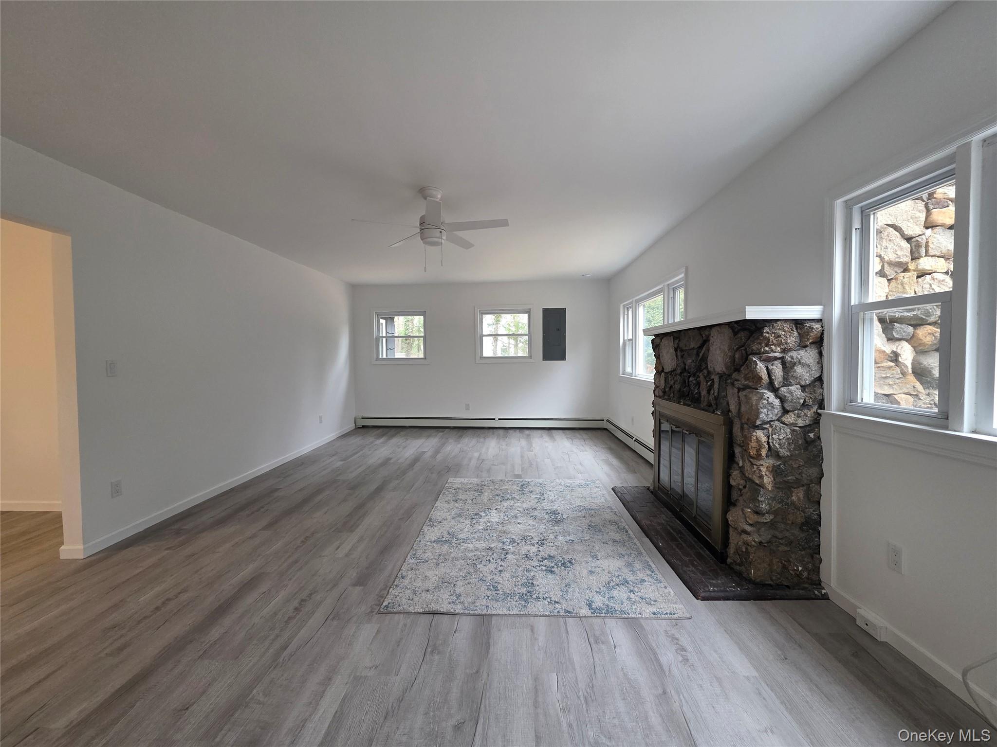 200 Deforest Road Dix Hills, NY 11746 - Photo 9 of 20 wooden floor in an empty room with a window