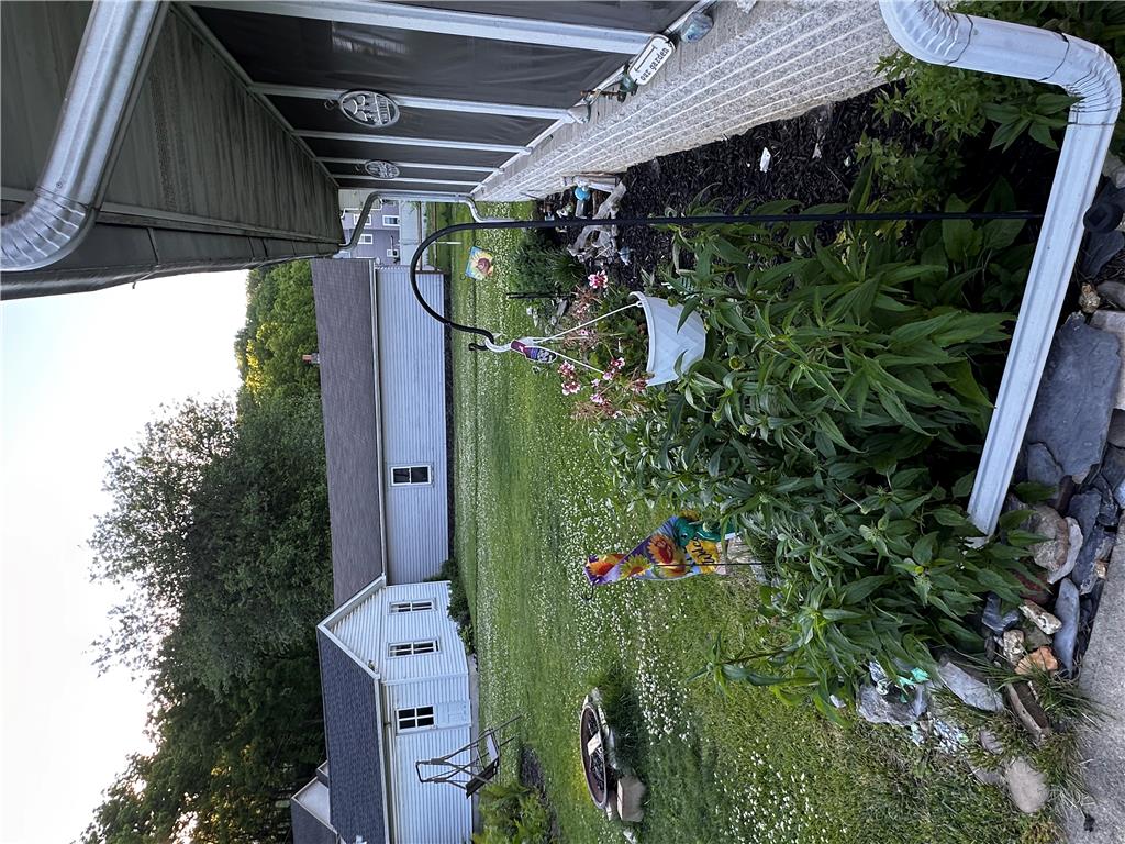5128 3rd Street Whitehall, PA 18052 - Photo 7 of 26 A lush garden with mature landscaping frames the back of this charming property.