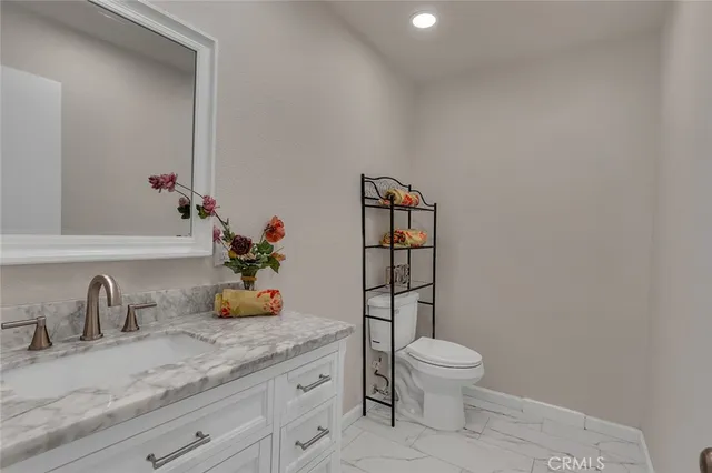 a bathroom with a toilet and a sink