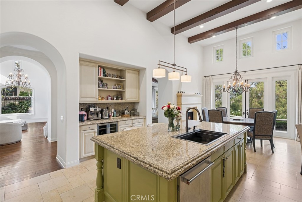 25 Wild Hawk Irvine, CA 92603 - Photo 12 of 36 a kitchen with a table chairs stove and wooden floor