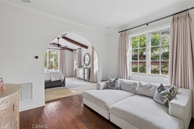 a large white bathroom with a double vanity sink a mirror and a bathtub